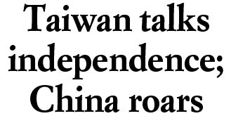 Taiwan talks independence; China roars